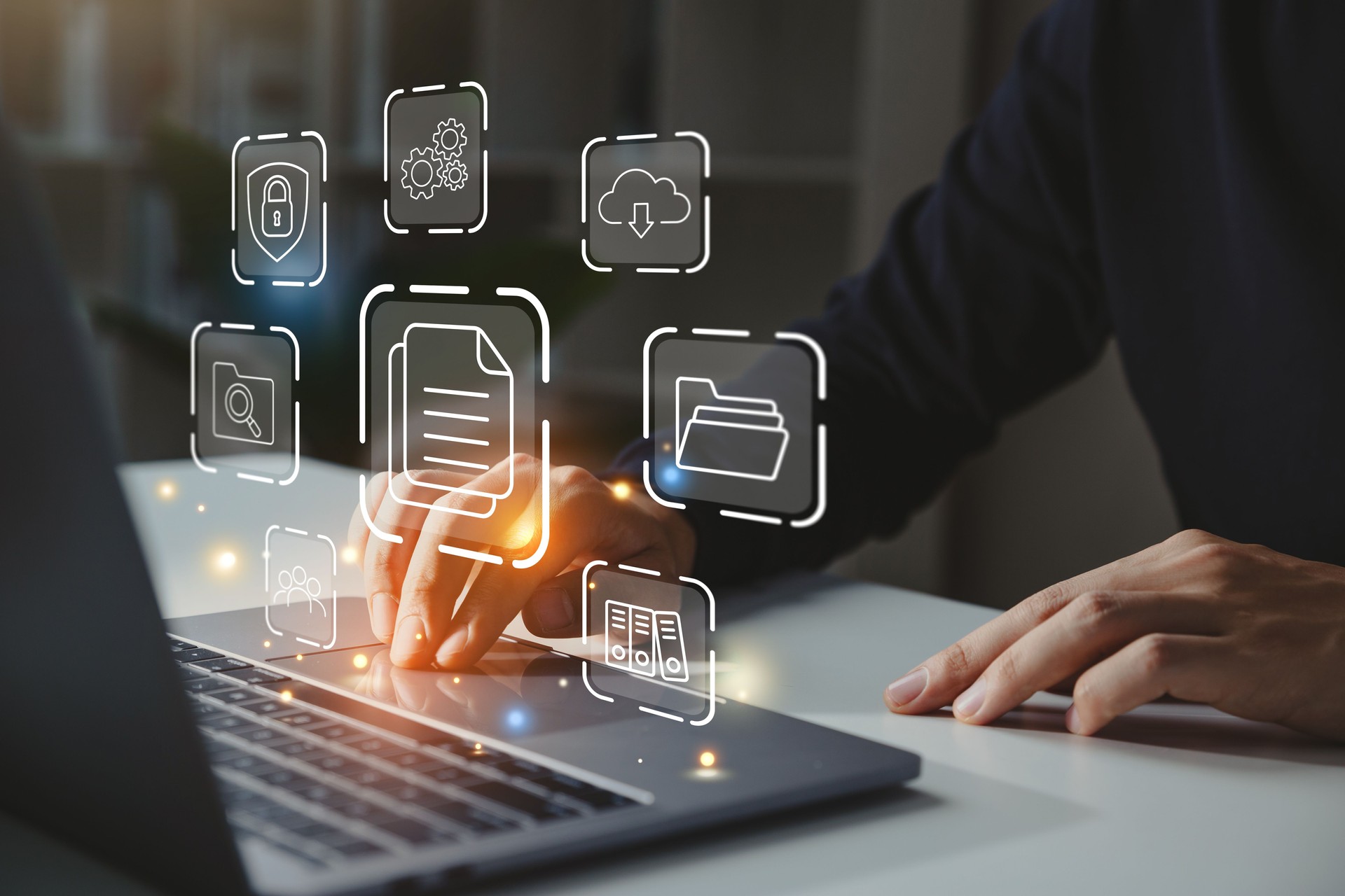 Businessman working on laptop with document management icon.